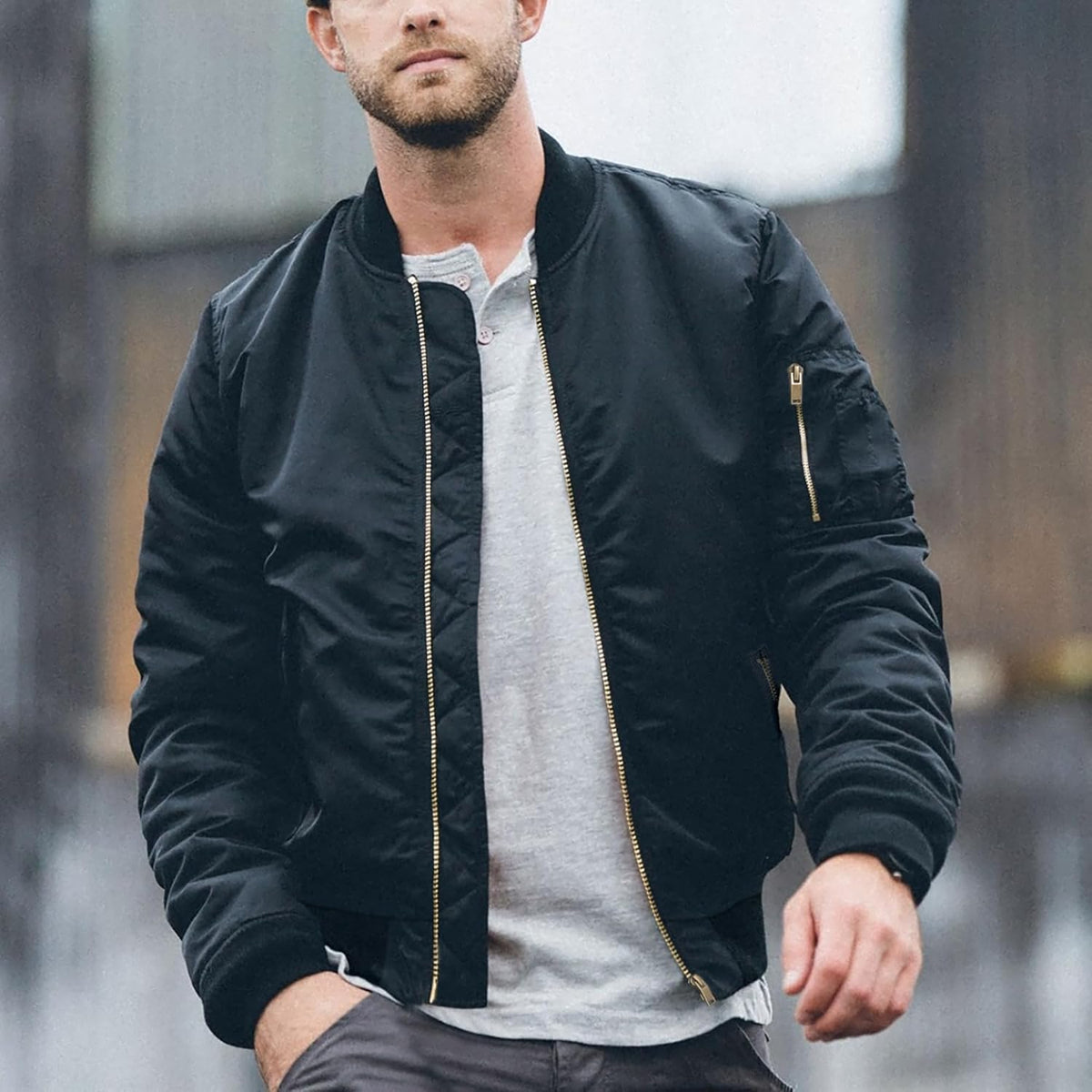 Men’s navy bomber jacket, full front zip, stand collar, side and arm zipper pockets.