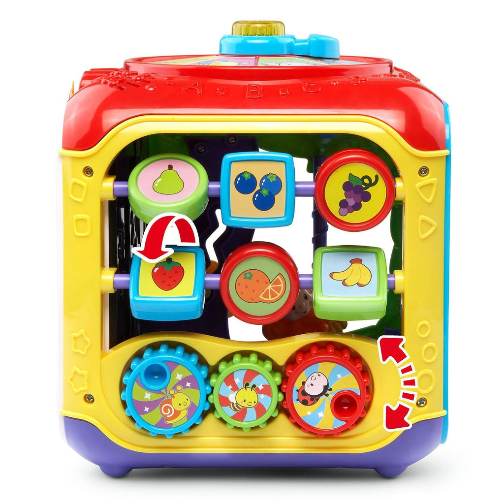 Red, yellow, and purple activity cube with spinning toy buttons