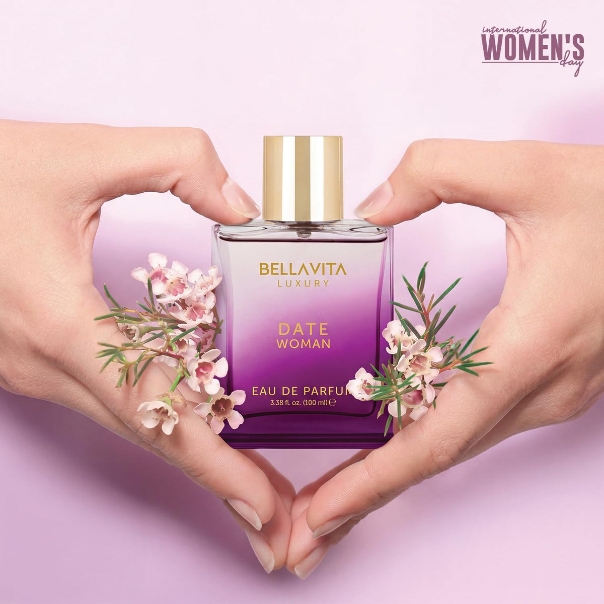 Date Woman eau de parfum bottle with gold cap, held in heart shape
