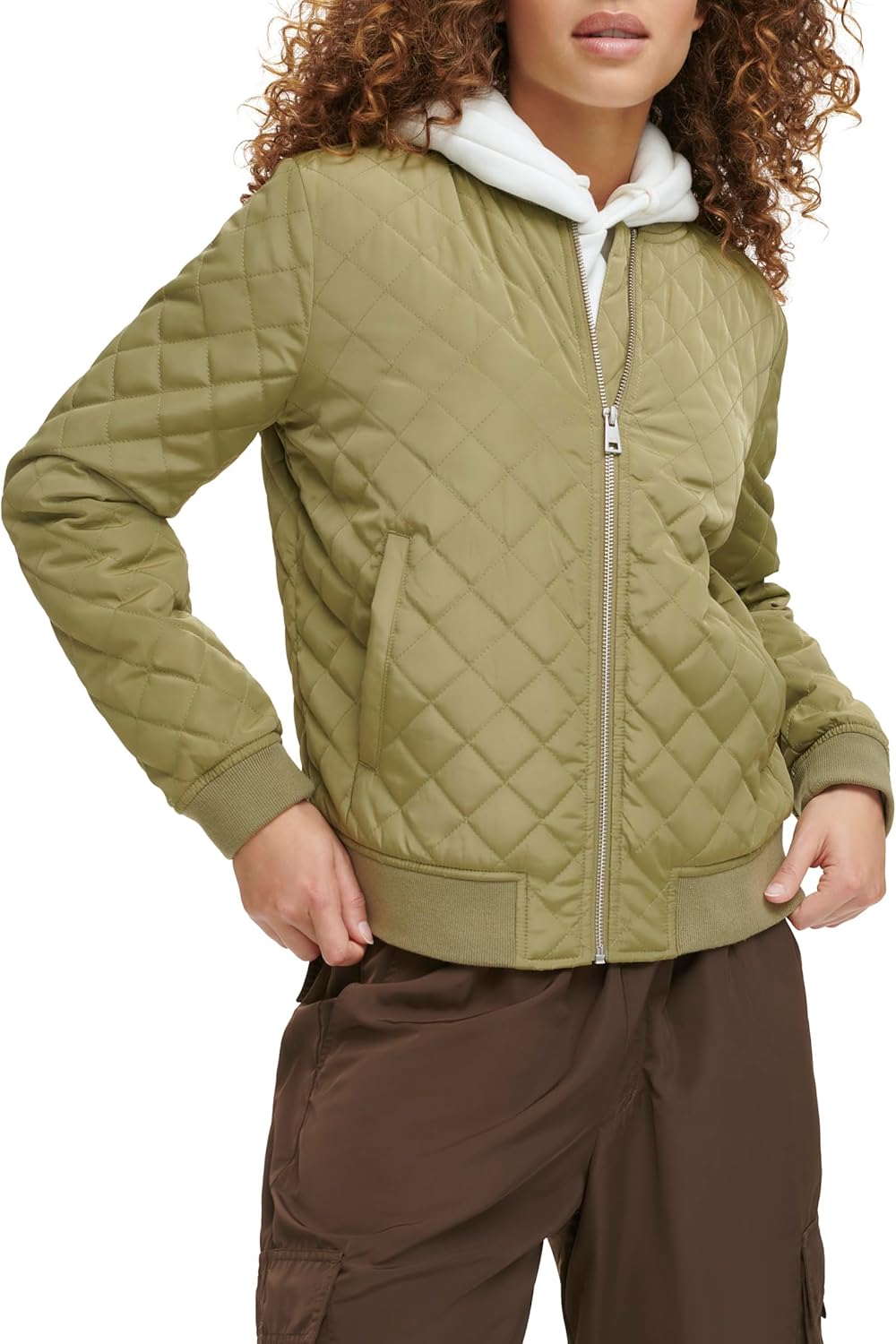 Quilted bomber jacket in olive green with front zipper, ribbed cuffs, and stand collar