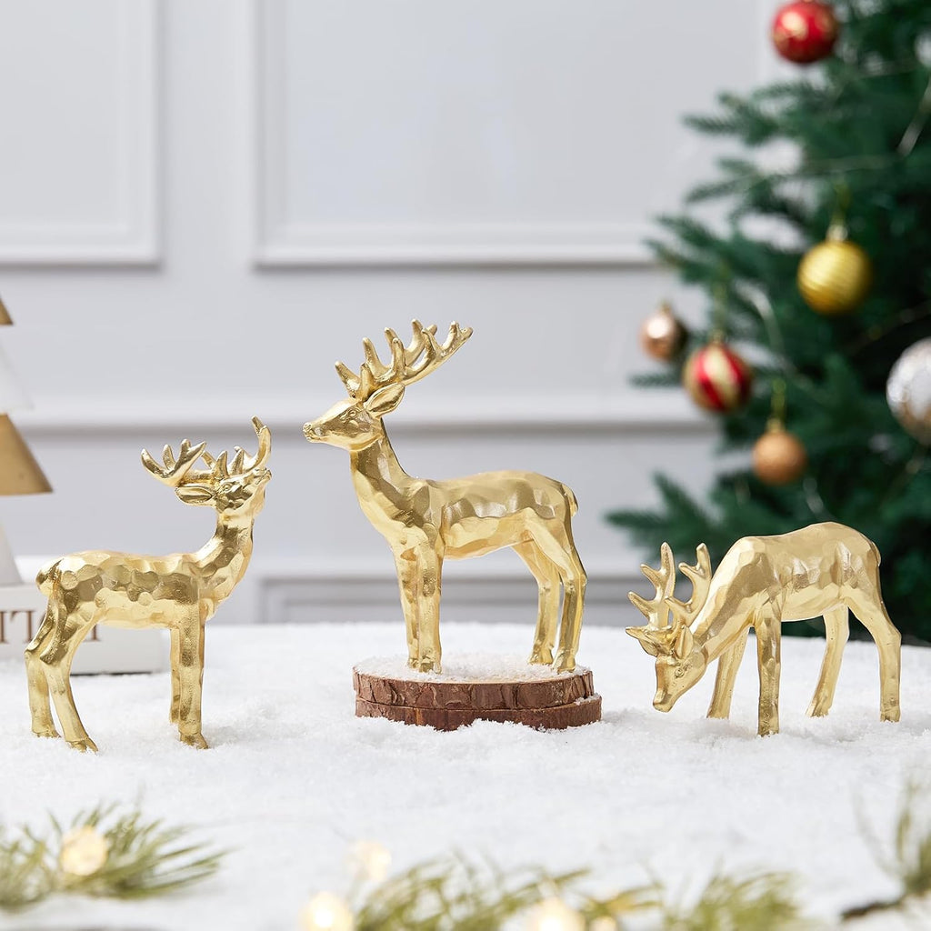 Gold resin reindeer set of 3, standing on round bases with raised antlers