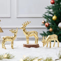 Three gold resin reindeer figurines on round bases, raised antlers for tabletop decor
