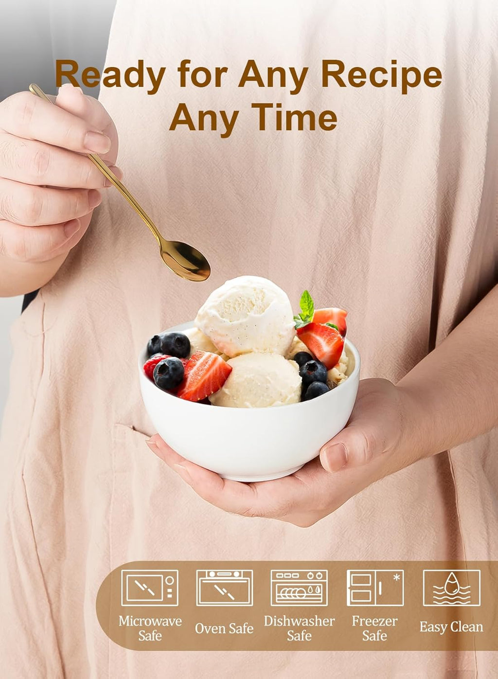 White ceramic small bowl held in hands, filled with dessert and fruit for serving