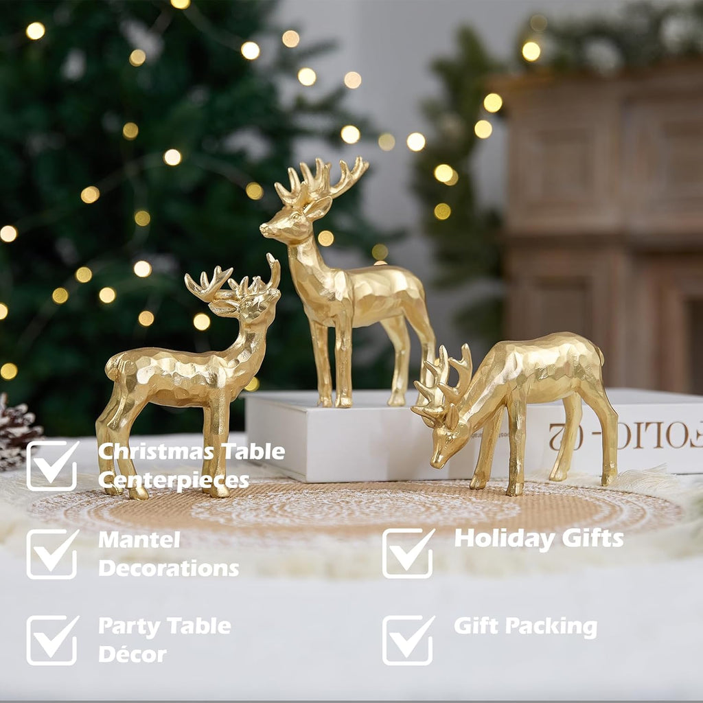 Gold resin reindeer figurines on a tabletop, three standing deer with raised antlers