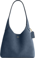 Navy suede shoulder bag with wide handles, COACH logo, magnetic snap top.