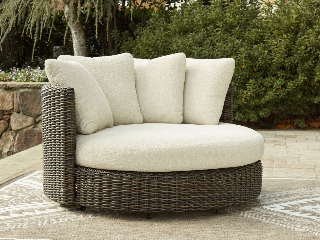 Beige upholstered swivel lounge chair with dark brown woven side panel