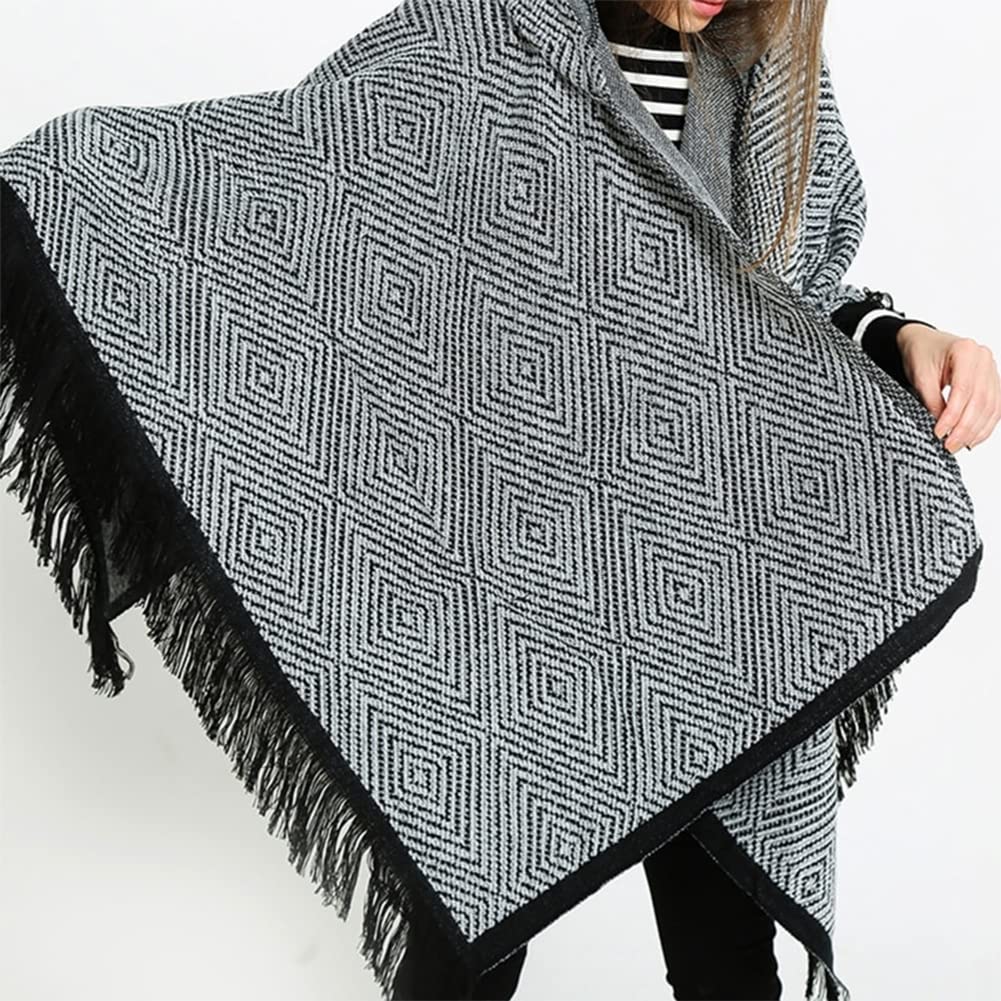 Women’s diamond-pattern knit poncho cape with hood, black trim, and long fringe border