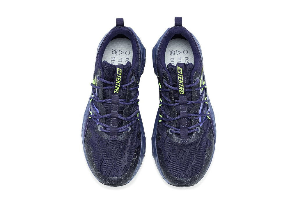 Pair of navy trail running shoes with neon green laces and logo on tongue