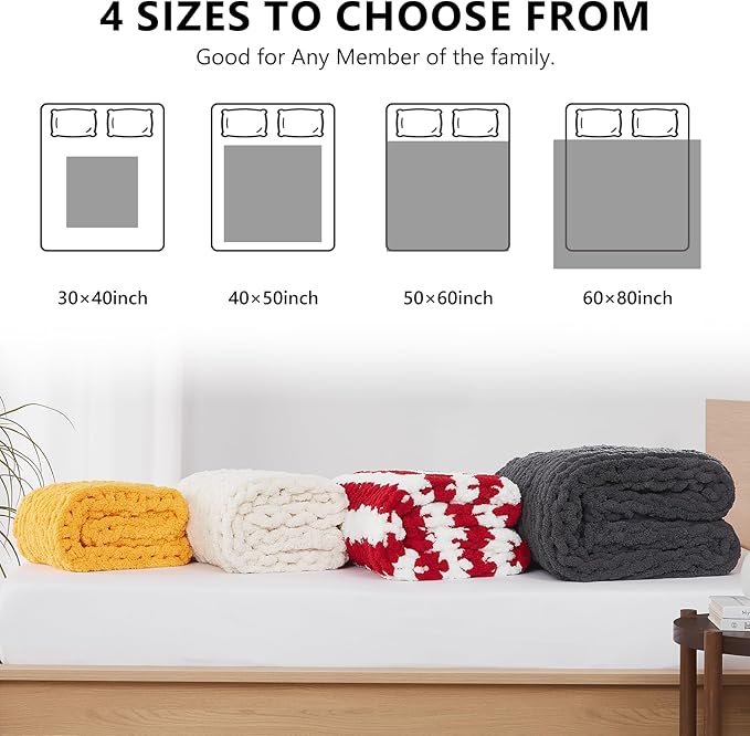 Chunky knit throw blanket stack in yellow, off-white, red, and dark gray