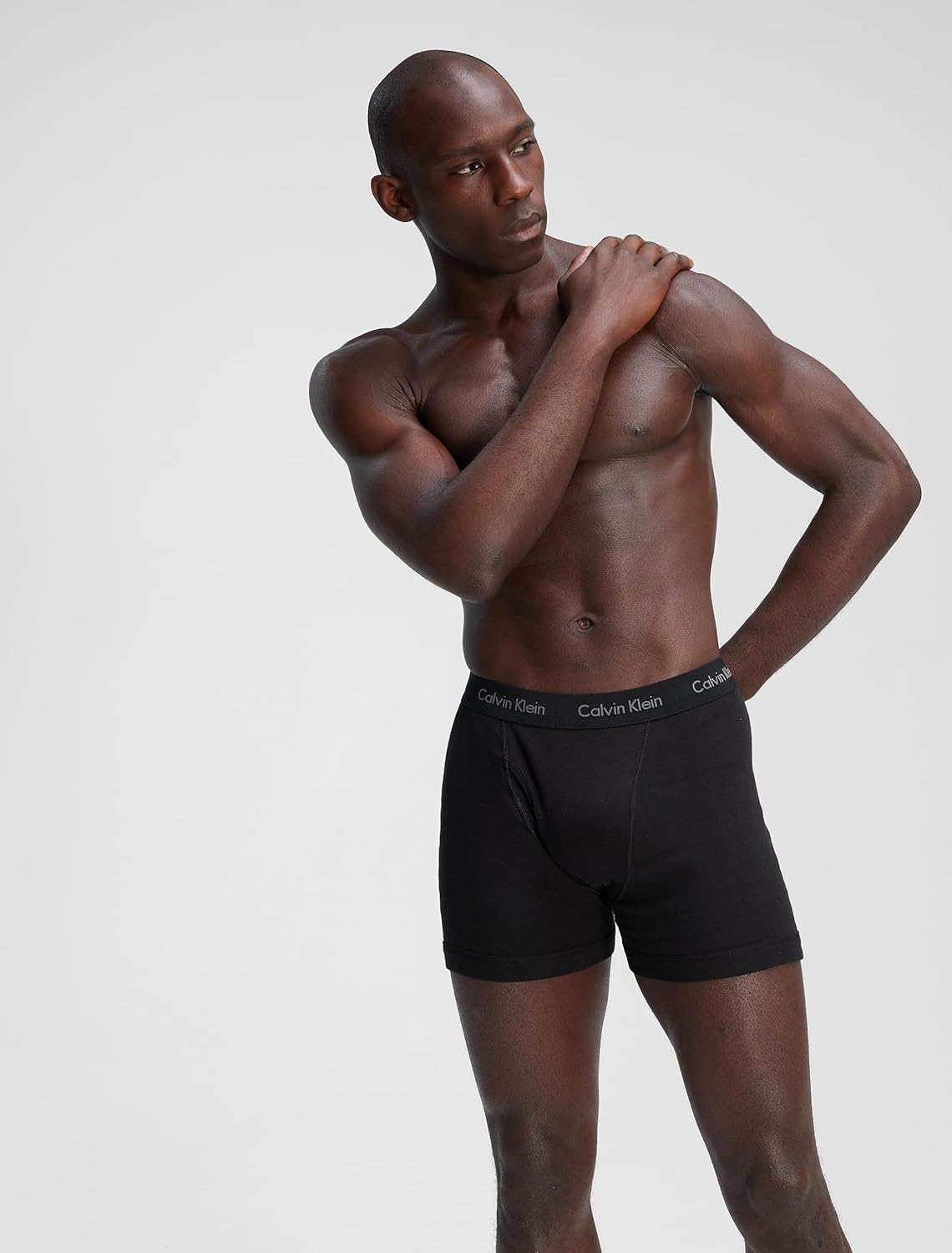 Men's black cotton boxer briefs, Calvin Klein logo waistband, model wearing
