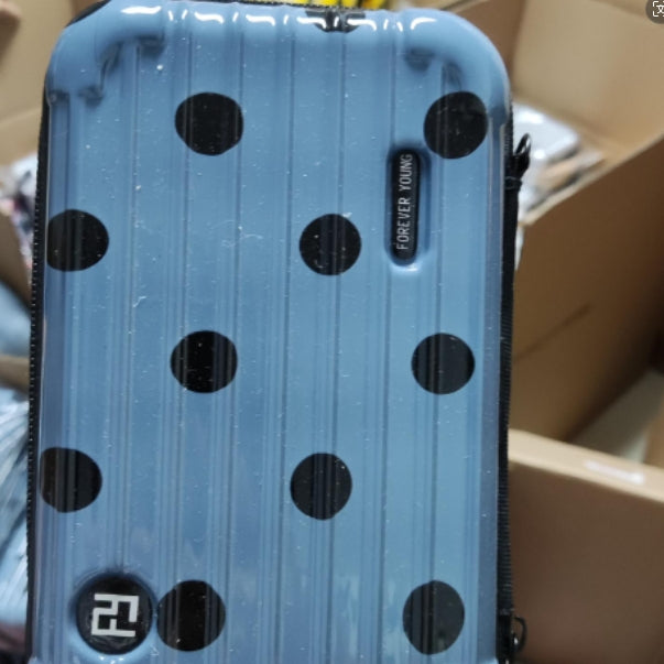 Cosmetic bag in blue with black polka dots and small side branding label.
