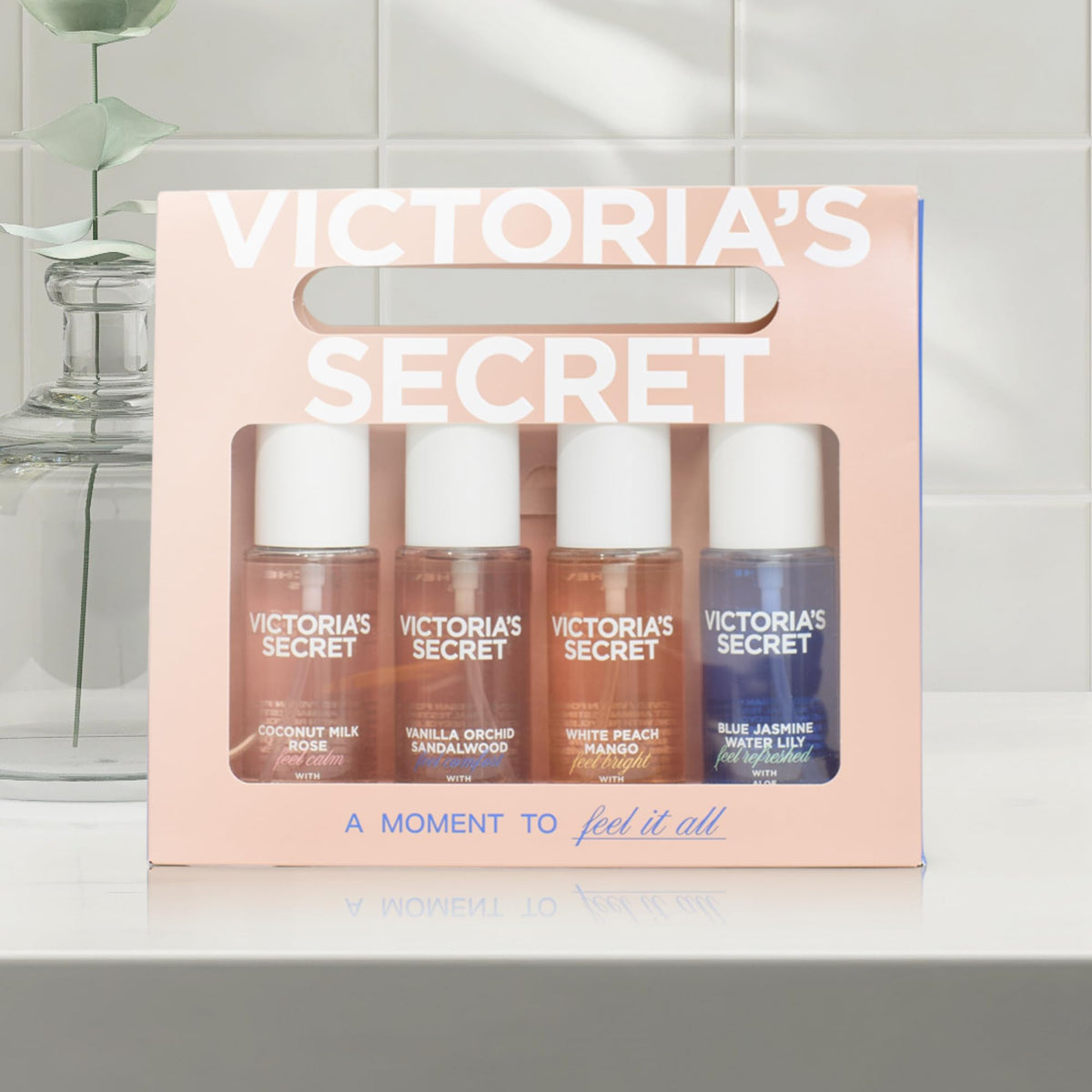 Fragrance mist gift set with four mini bottles in assorted scents.