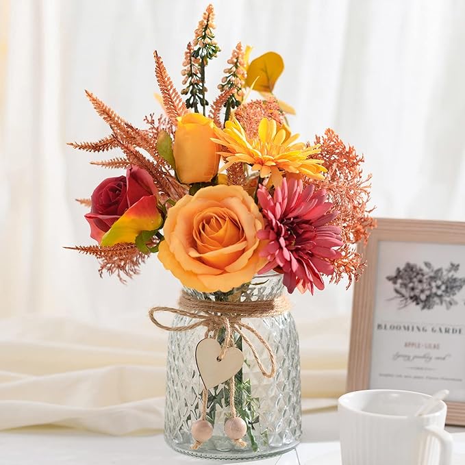 Faux silk flower arrangement in textured glass vase with twine and heart charm