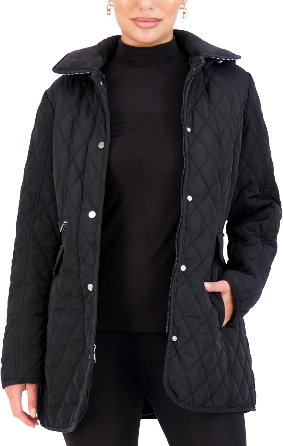 Black quilted jacket with stand collar, button front, and side flap pockets