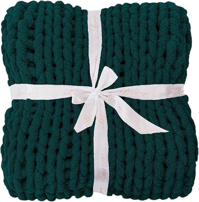 Dark green chunky knit throw blanket set, folded with white ribbon bow