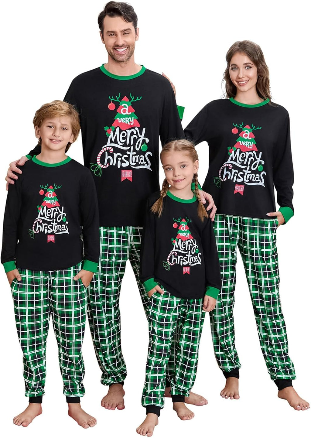 Family Christmas pajama set with black tops, green trim, and green plaid pants on four people