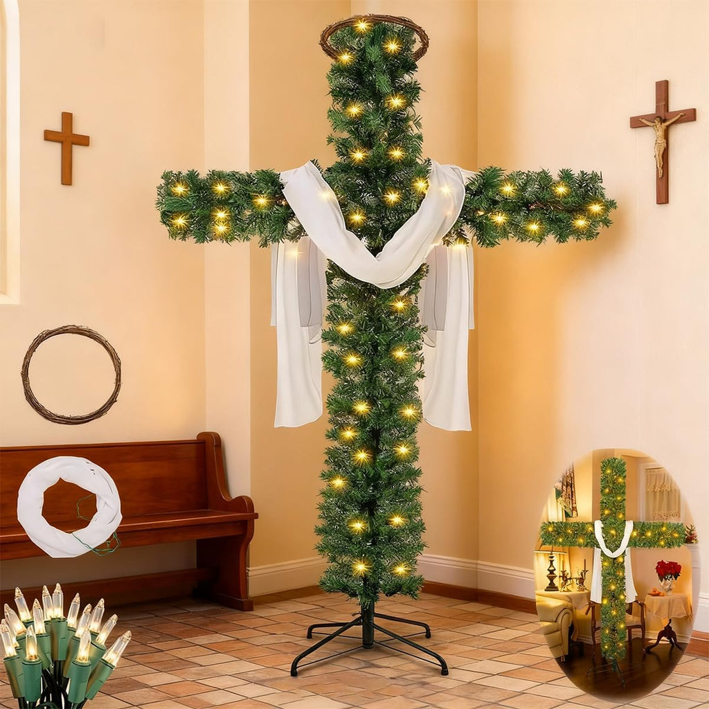 Pre-lit cross-shaped artificial pine tree with white drapes and warm lights on metal stand