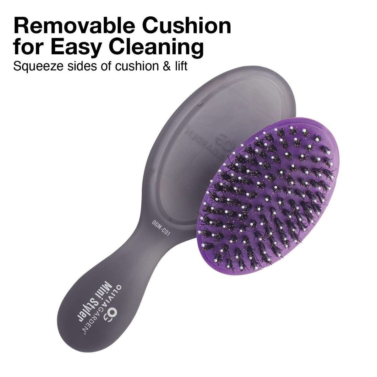 Purple brush head with removable gray cushion base and dark handle.