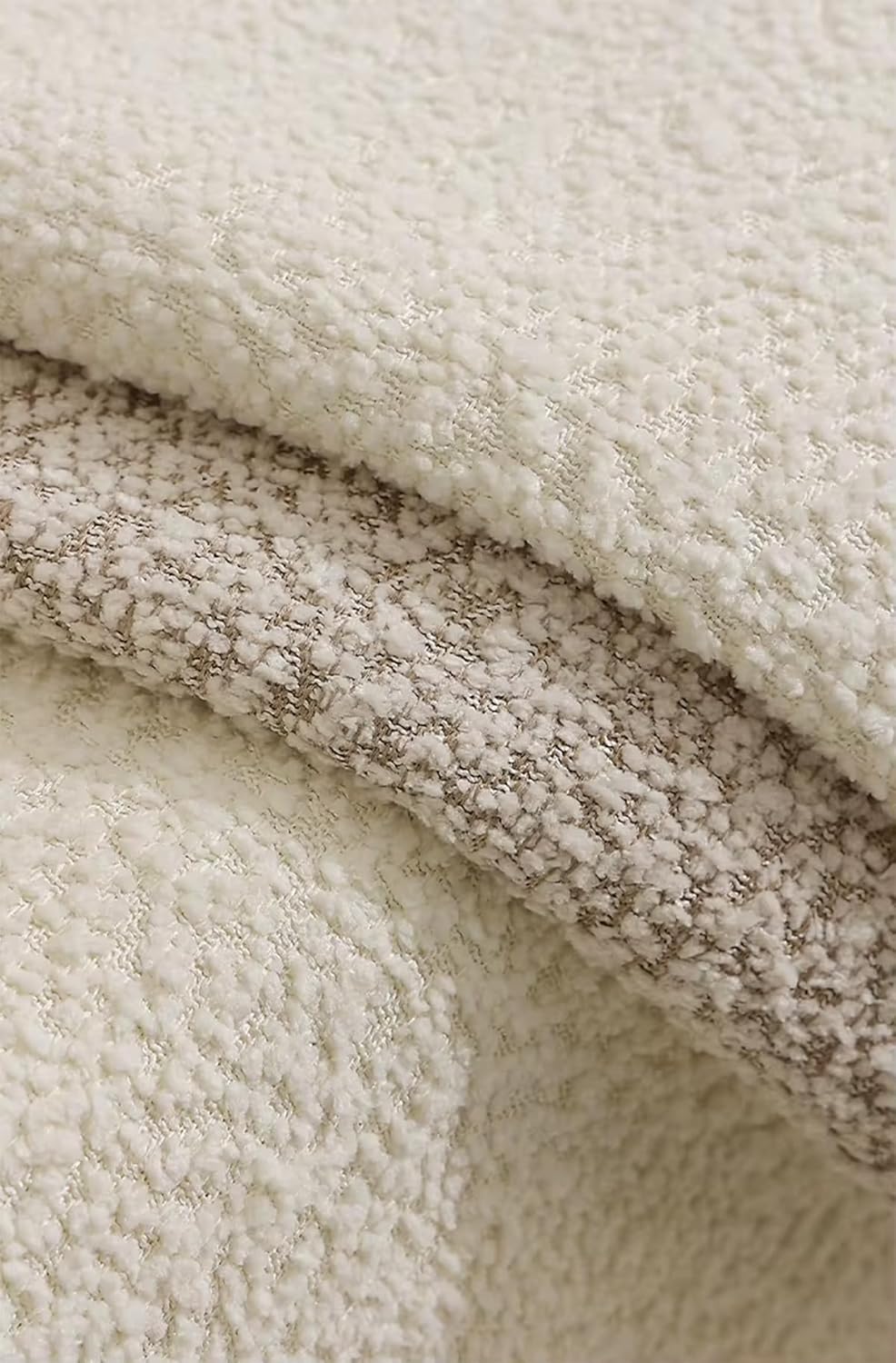 Chenille bouclé throw pillow in cream and brown textured fabric