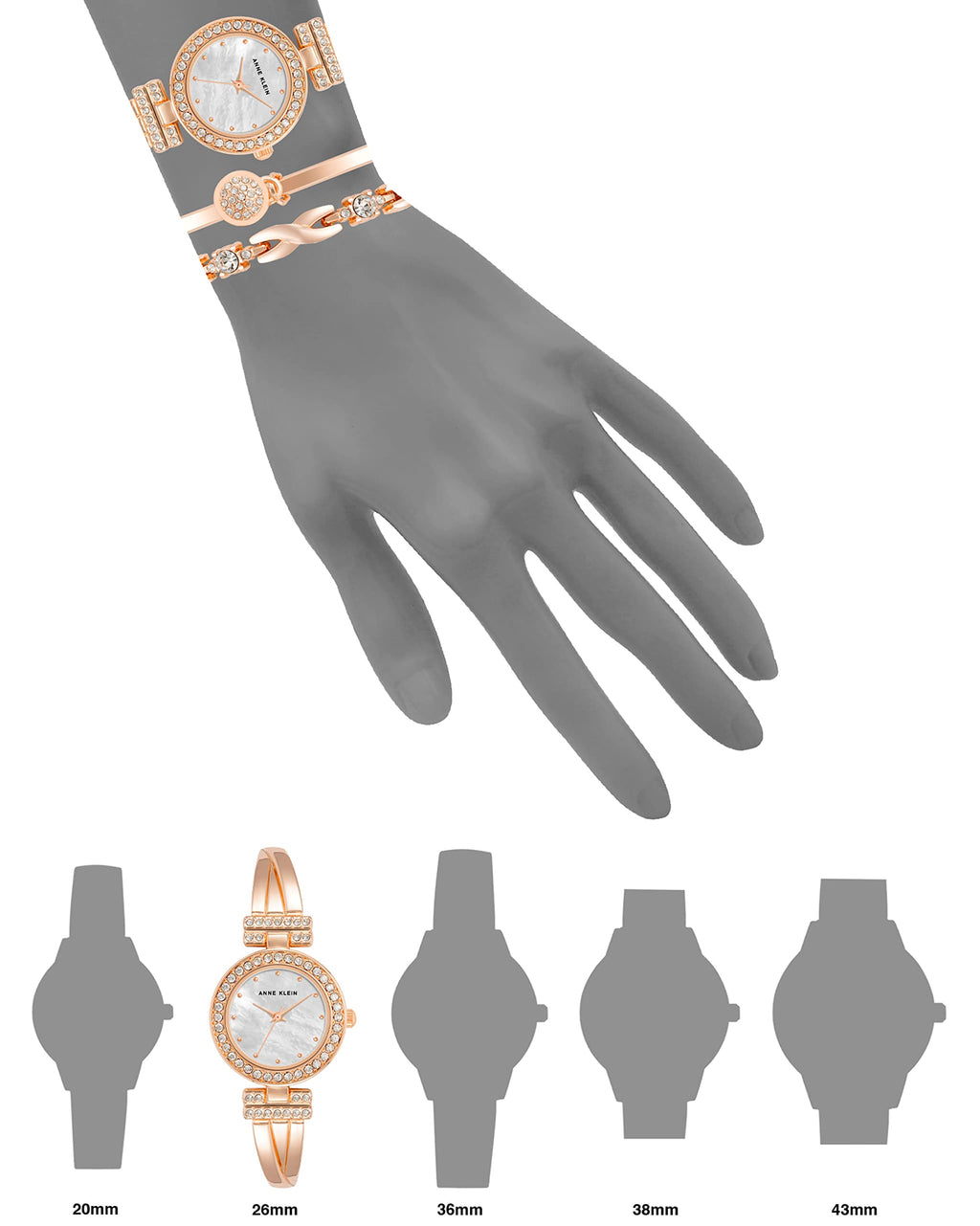 Black-dial bangle watch with crystal bezel and gold-tone linked bracelets, flat view