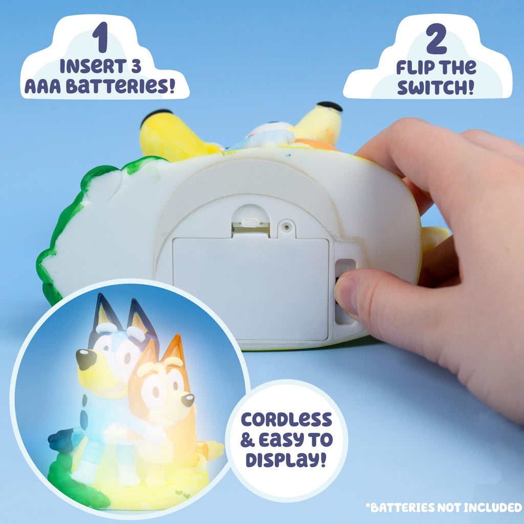 Cordless night lamp figurine with light-up switch and hands pressing the back