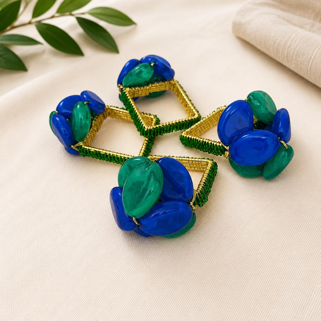 Four multicolor gemstone beaded napkin rings with blue and green oval stones