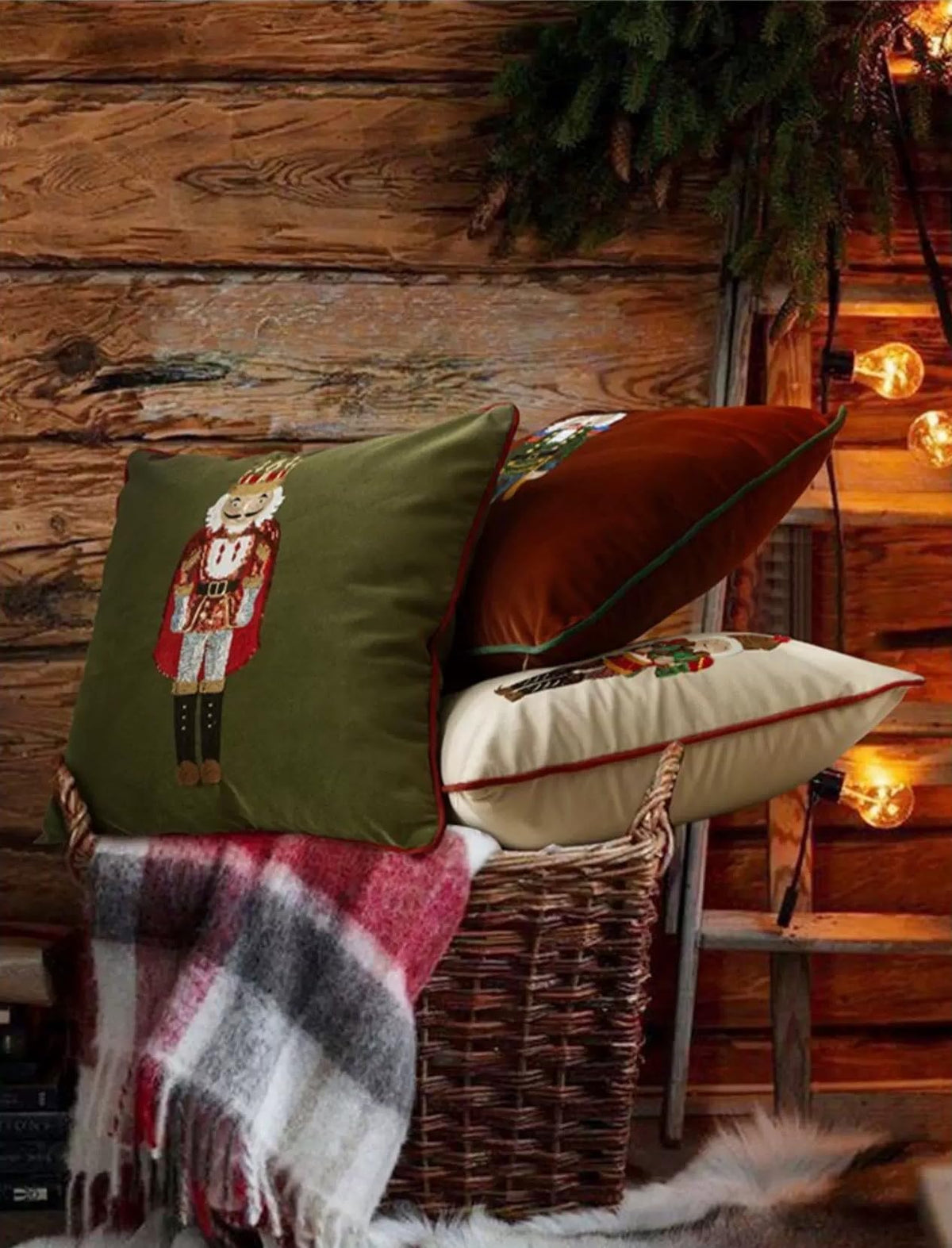 Green velvet nutcracker pillow cover with embroidered figure and dark red piping border
