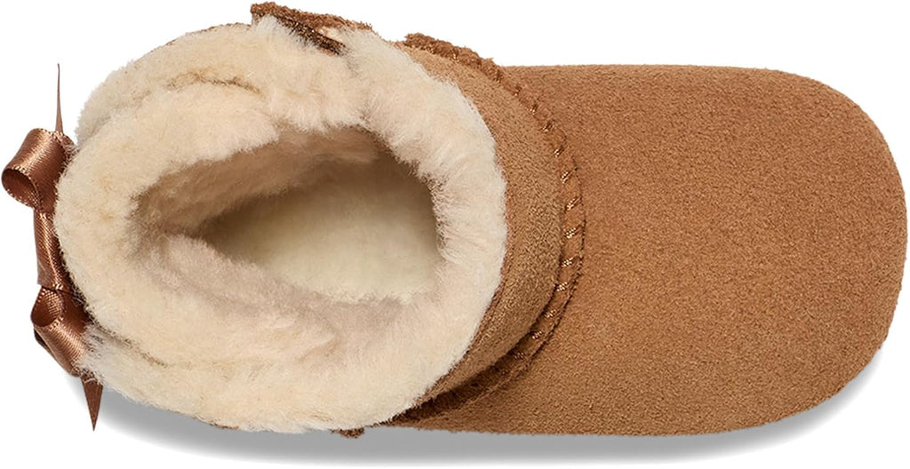 UGG baby Bailey bow boots chestnut suede with plush shearling collar, side view