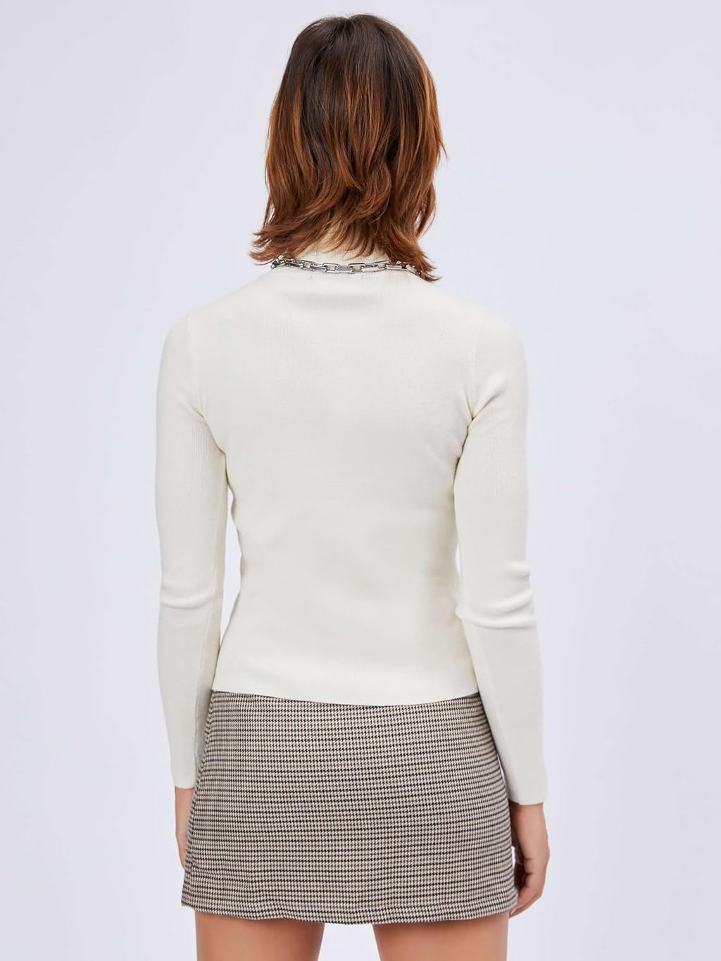 Ivory mock turtleneck knit top, long sleeves, back view.
