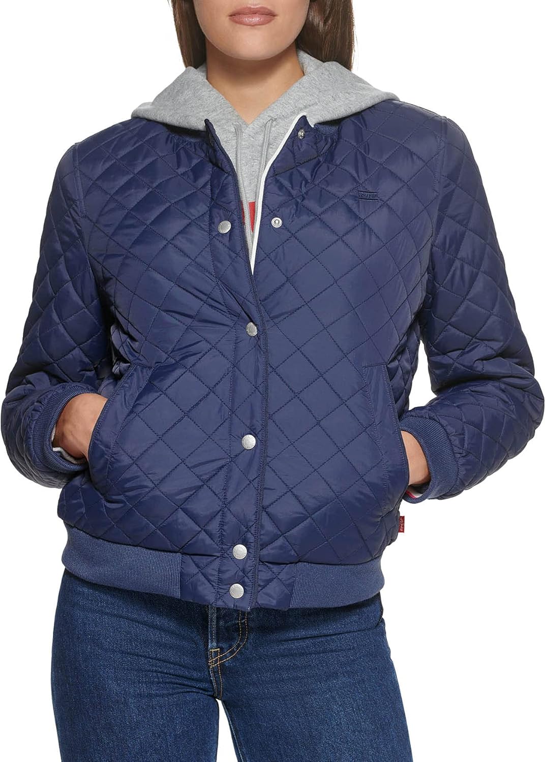 Quilted bomber jacket in navy with front zipper and hooded collar, ribbed cuffs