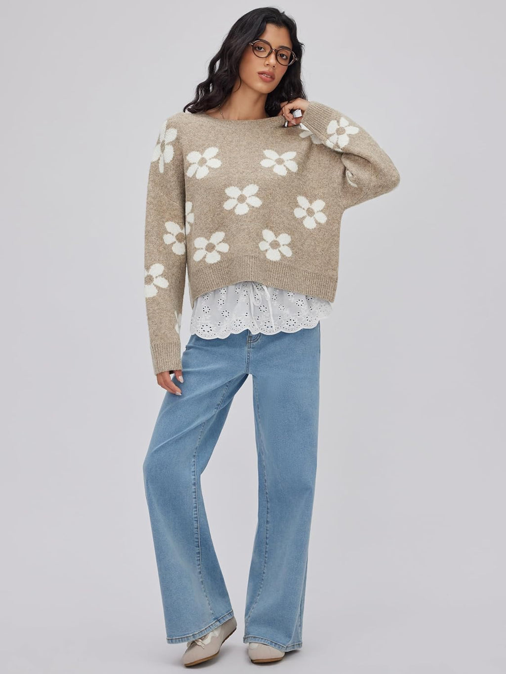 Women’s khaki floral knit pullover sweater with long sleeves, worn with blue jeans