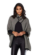 Grey speckled knit poncho cardigan with black trim and buckle at the neckline