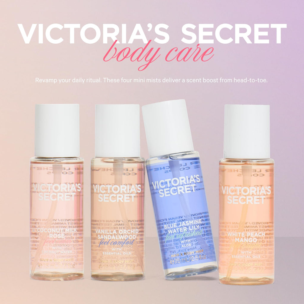 Four mini fragrance mist bottles standing side by side for display.