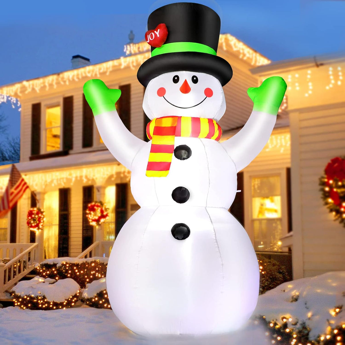 White inflatable snowman with black top hat, green band, Joy topper, striped scarf, raised arms