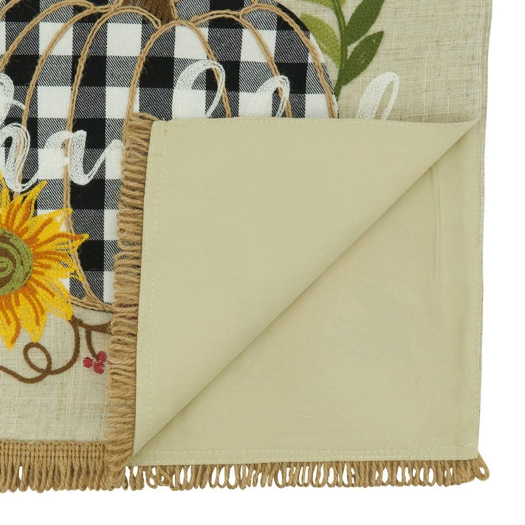 Folded natural table runner corner with plaid pumpkin print and fringed edge