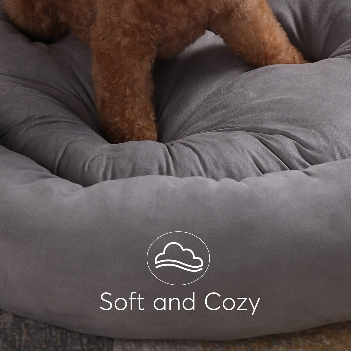 Gray round dog bed cushion with bolstered rim and “Soft and Cozy” label.