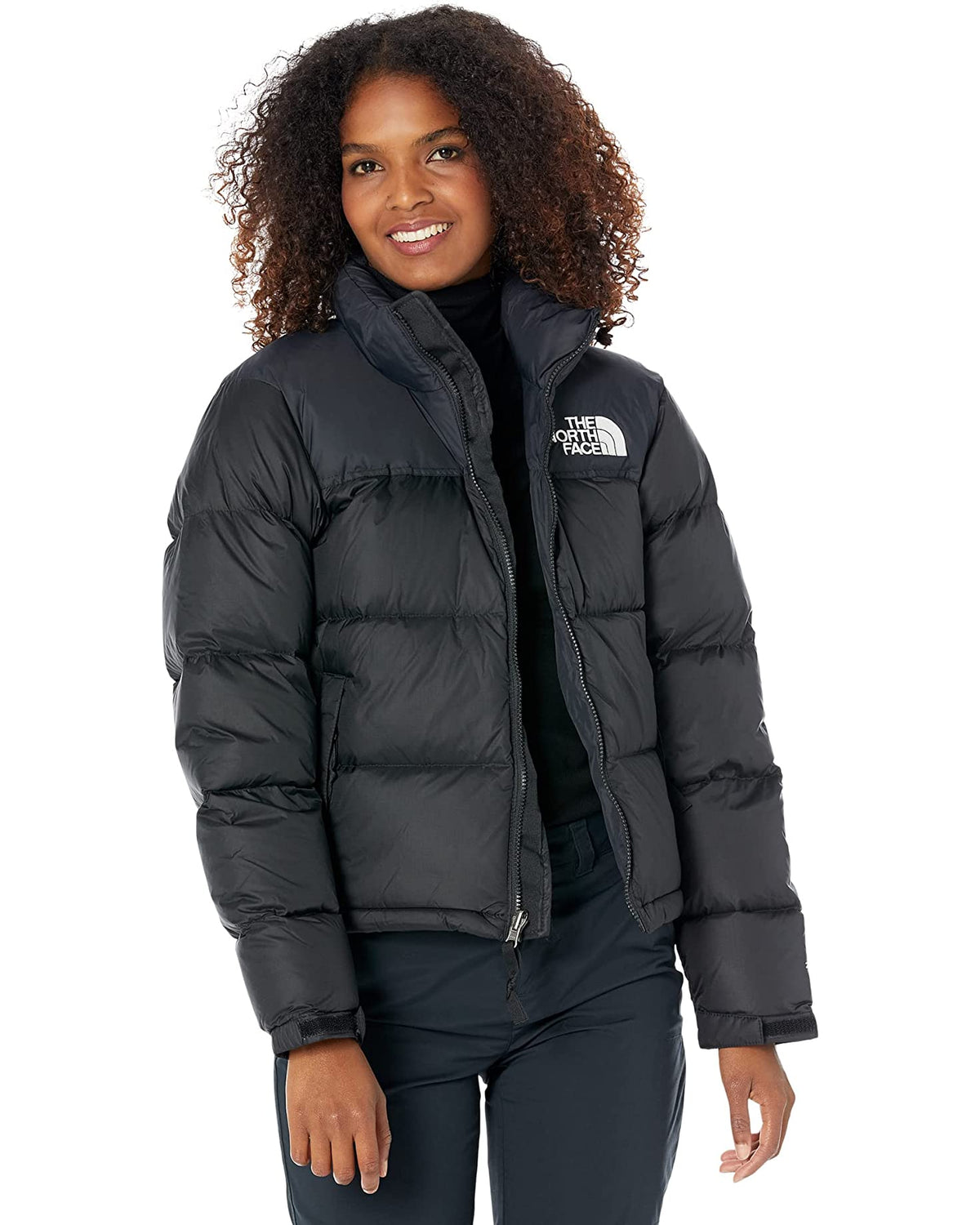 Women's black quilted puffer jacket with stand collar and zip front