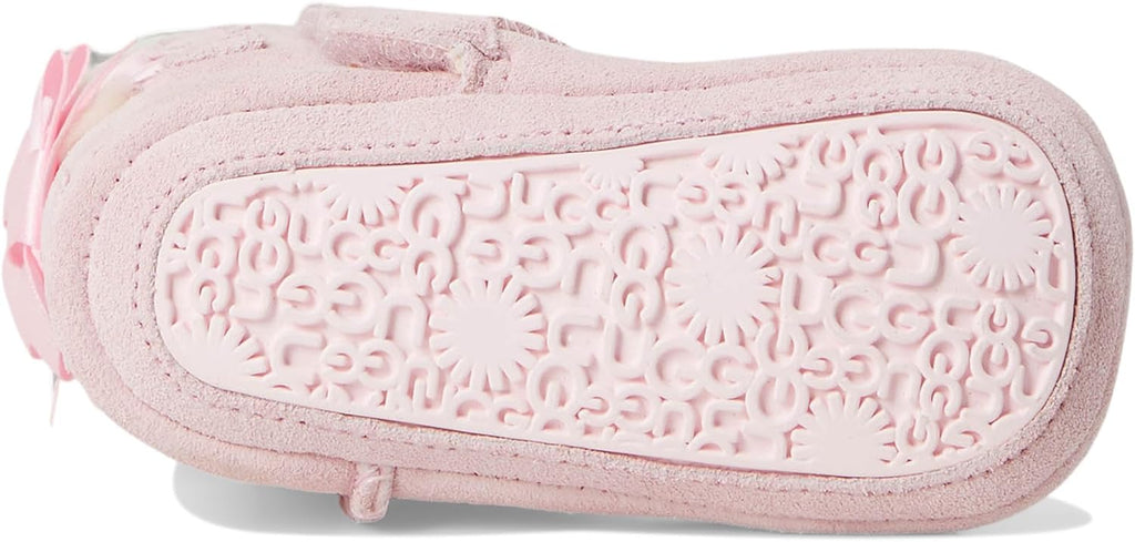 Pink baby suede booties with embossed rubber sole pattern