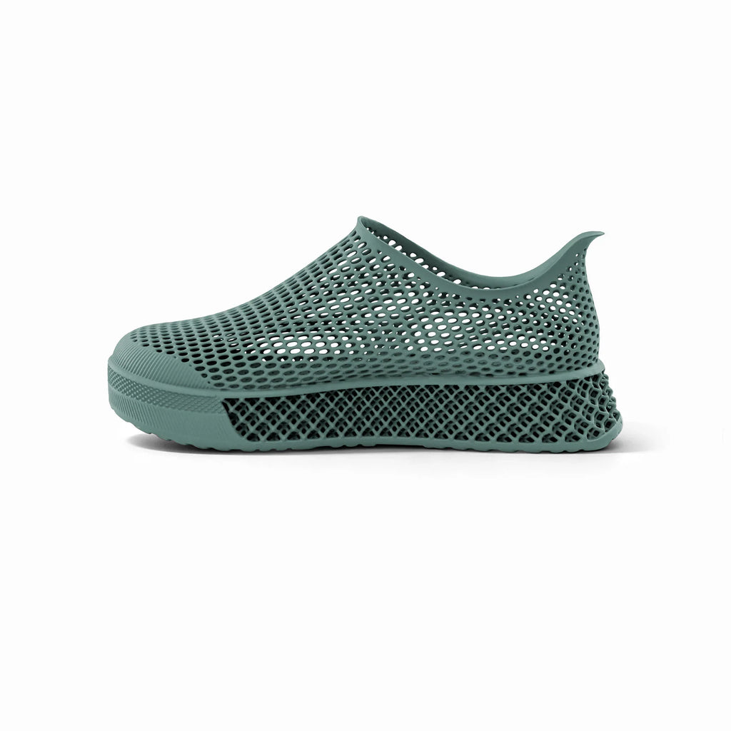 Green 3D-printed casual sneakers, side view with perforated mesh upper