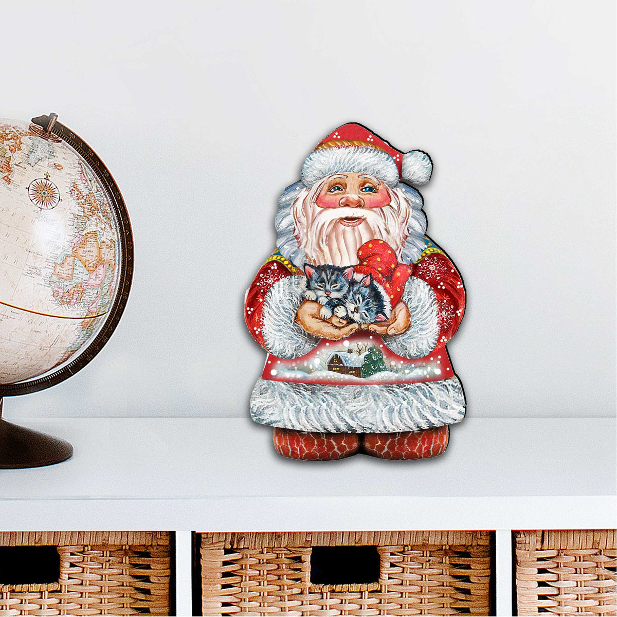 Santa and kitten Christmas door decor cutout displayed on a light background surface