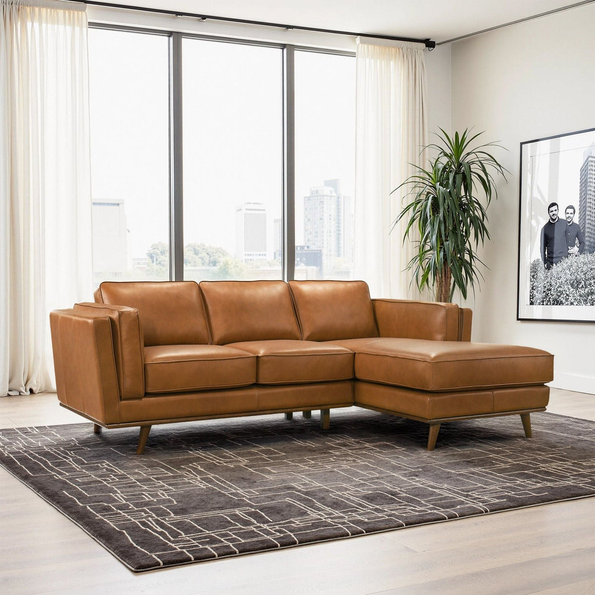 Light brown sectional sofa with chaise and back cushions
