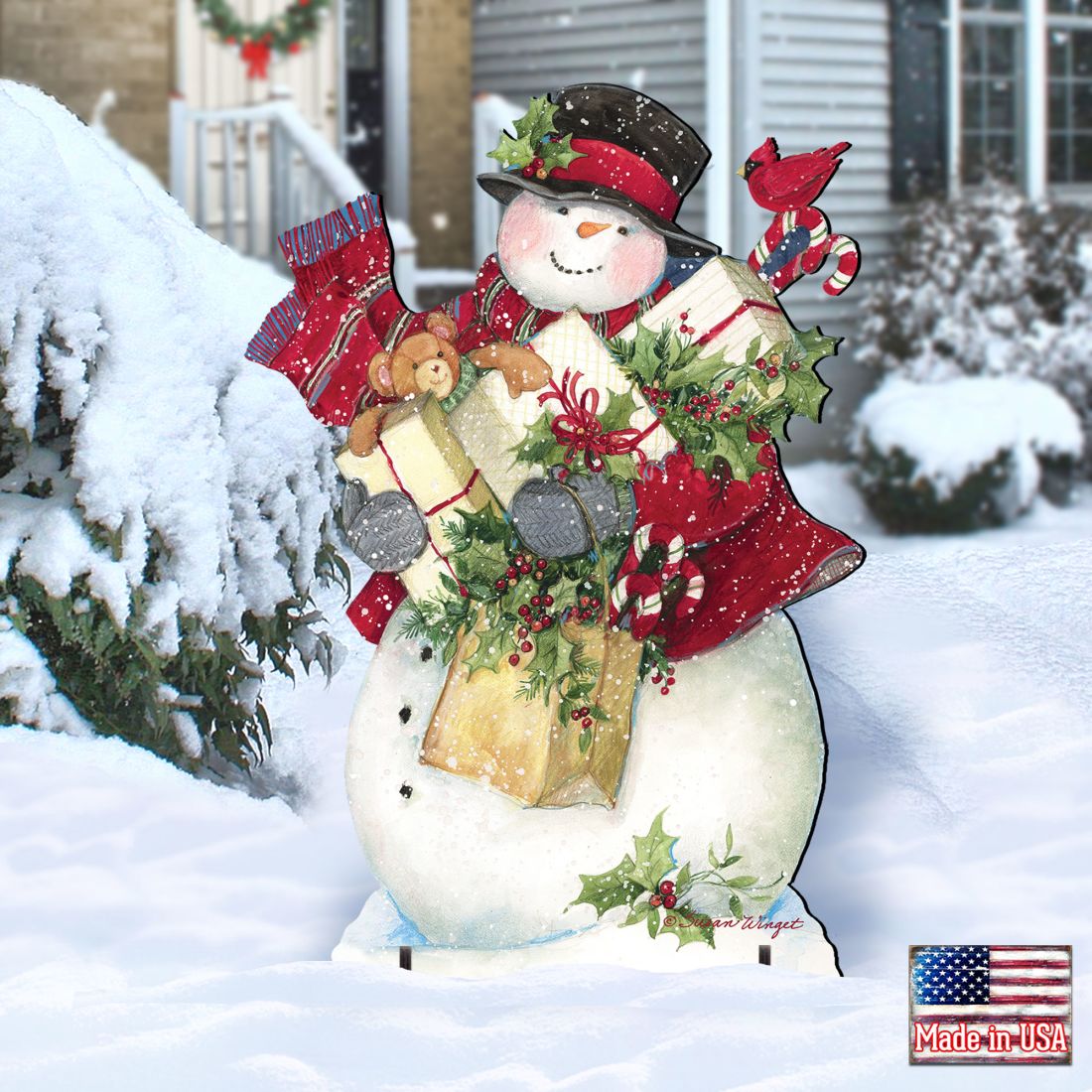 Snowman Christmas yard decoration sign in winter scene, holding gifts and wearing red hat