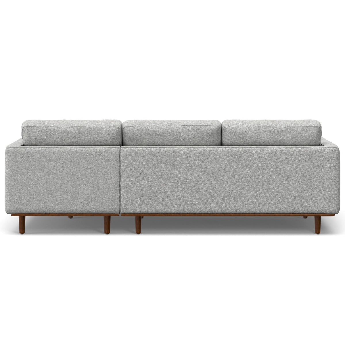Upholstered sectional sofa in light gray fabric with boxed back and exposed wooden legs