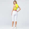 White fitted yoga capris with pockets, moisture-wicking fabric