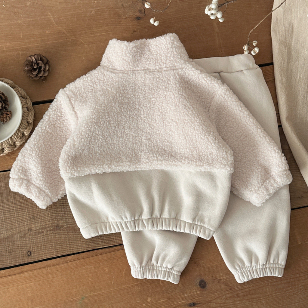 Light beige stand-up collar half-zip sweater with fleece texture, back view