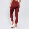 Wine active leggings with criss-cross ankle cutouts, cropped length
