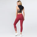 Brick red active capri leggings with criss-cross ankle cutouts