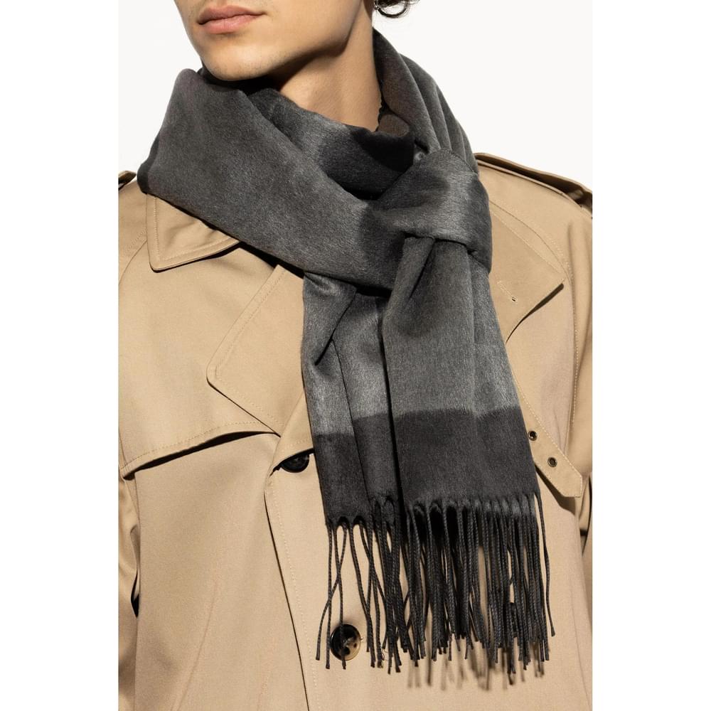 Saint Laurent gray men’s scarf draped over shoulders with long fringe ends