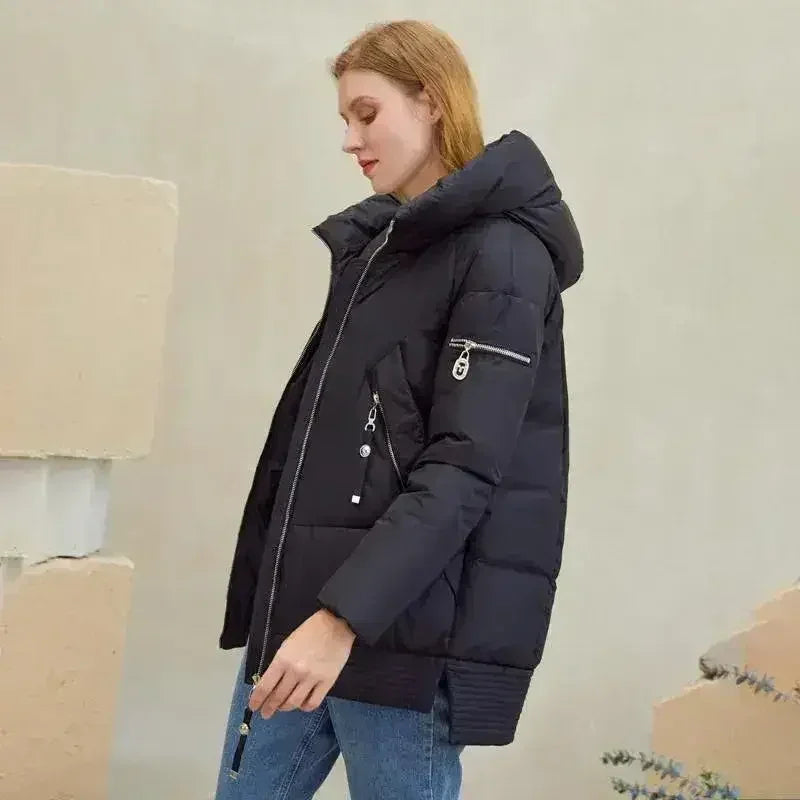 Black hooded padded parka with front zipper and zip sleeve pocket detail, side view