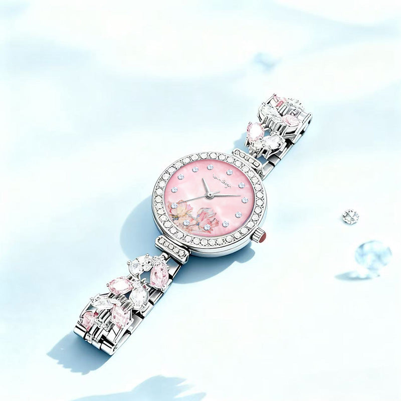 Pink floral dial wristwatch with silver rhinestone bracelet and oval charm details